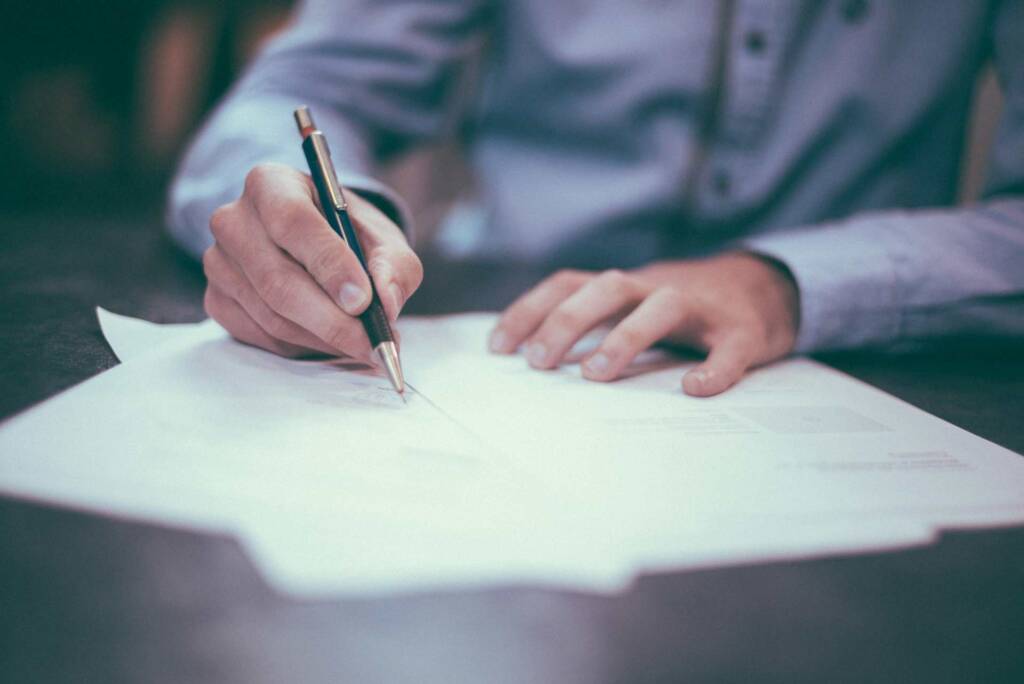 Trademark Lawyer signing Intellectual Property Laws